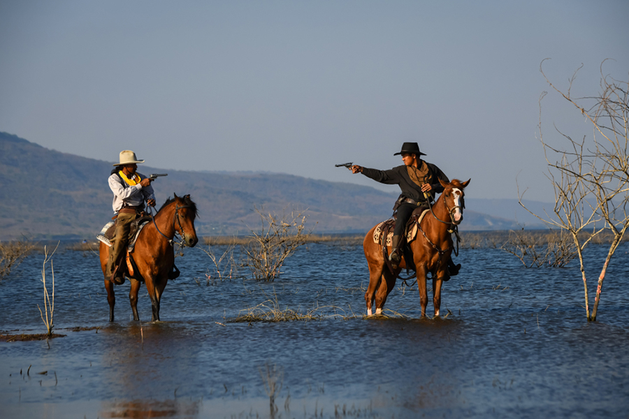 Cowboys Pointing Guns