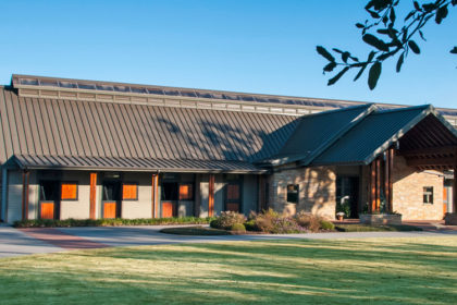 Large horse barn with brown metal roof